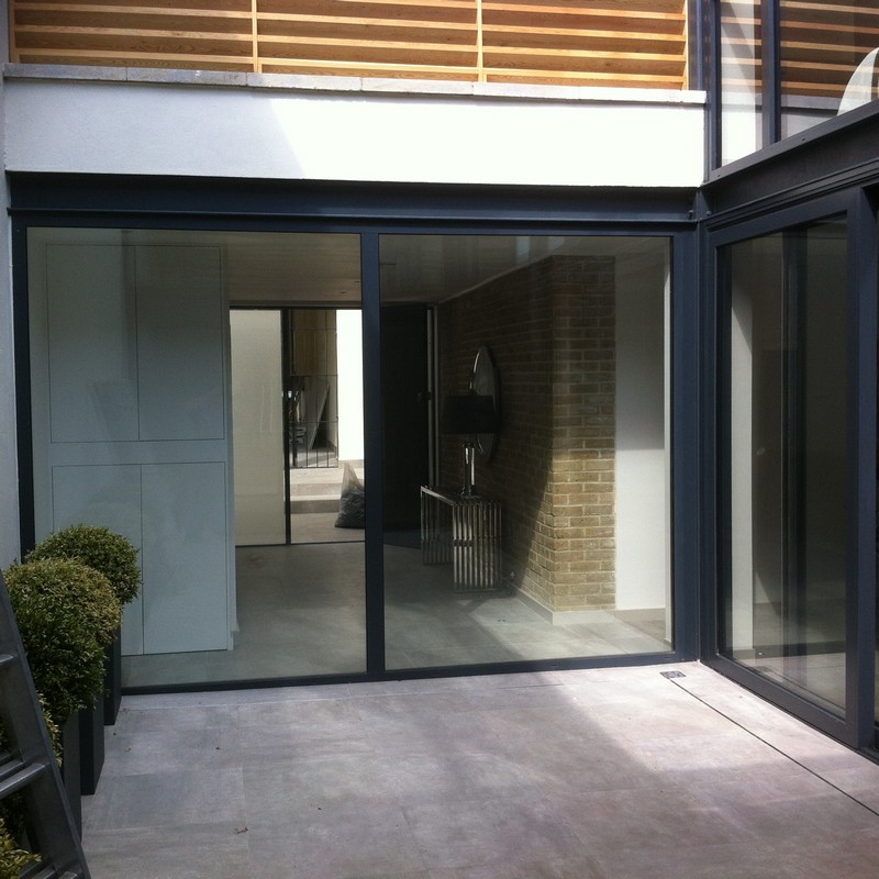 Floor-to-ceiling sliding doors opening to courtyard in Kentish Town