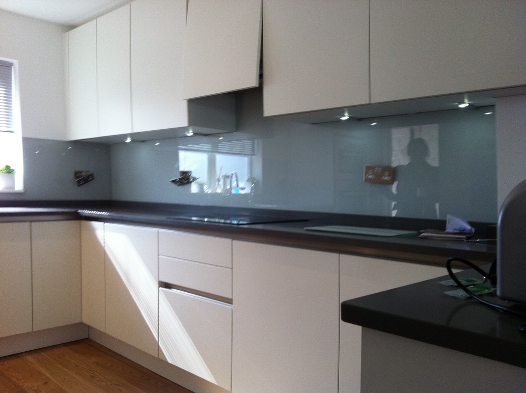 Grey glass kitchen splashback with LED lighting in Kentish Town