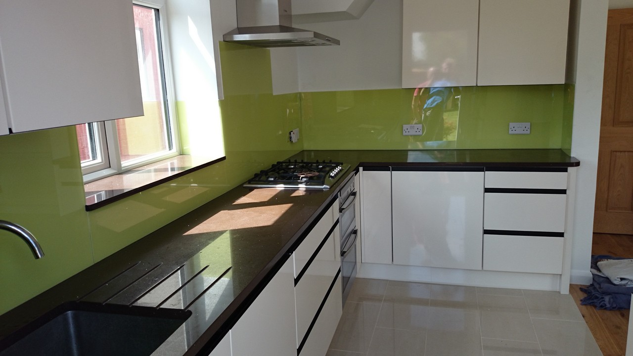 Lime green glass kitchen splashback installed by Kentish Town glaziers